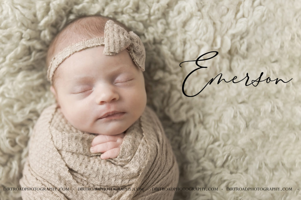 picture of baby in cream wrap with bow, nebraska newborn photographer