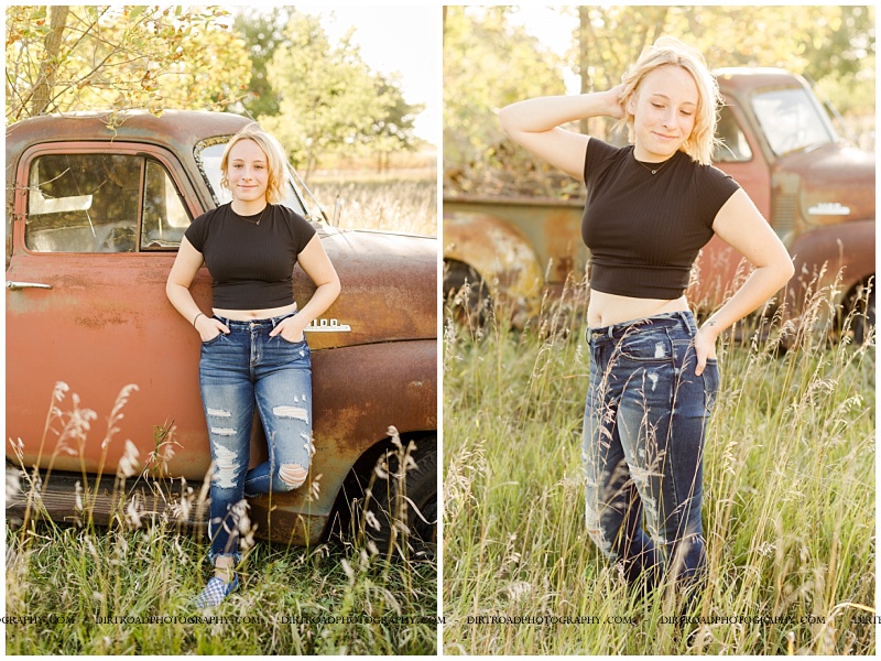 senior picture of girl with short blond hair standing in front of old rusty pick-up with tall green grass and trees. senior girl is wearing black tshirt crop top and jeans. wilber-clatonia high school senior. nebraska senior photographer located near lincoln, nebraska.