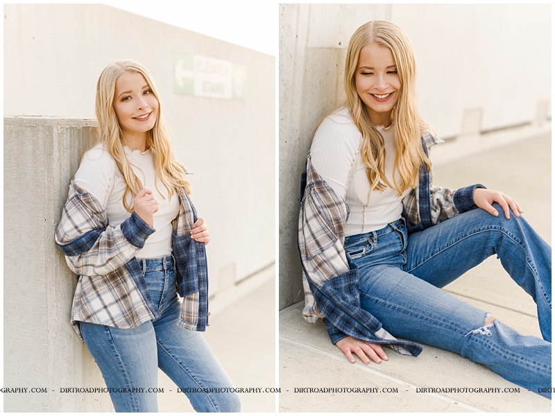 senior picture of girl in downtown parking lot located near haymarket park in lincoln, nebaska. seinor picture of girl wearing flare jeans, white shirt and plaid jacket with long blond hair. lincoln southwest high school senior pics. nebraska senior photographer located near lincoln, nebraska.