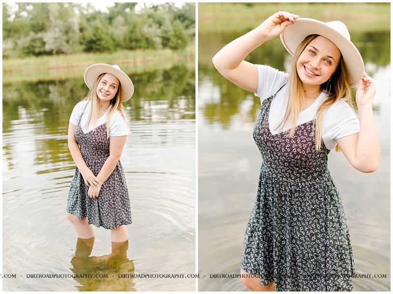 picture of senior girl taken at camp augustine near grand island, nebraska. senior picture of girl standing in water wearing floral print dress and white tee with long brown hair. picture of senior girl taken at sunset near water with sand during the summer. pictures taken by dirt road photography, lincoln nebraska best senior photographer.