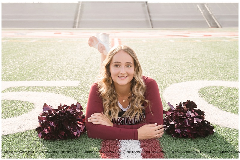 Waverly High School senior girl in cheer uniform with pompoms