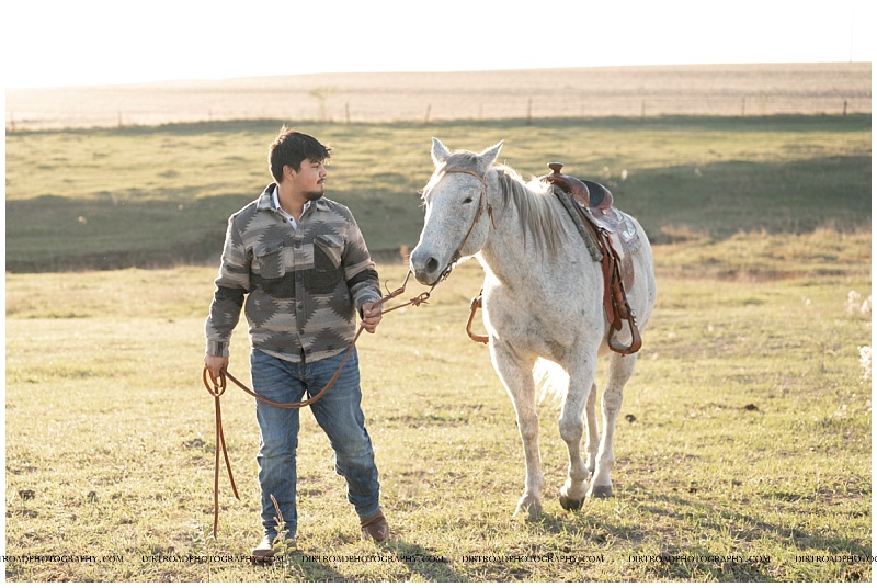 Nebraska senior boy standing beside white horse at sunset near Beatrice
