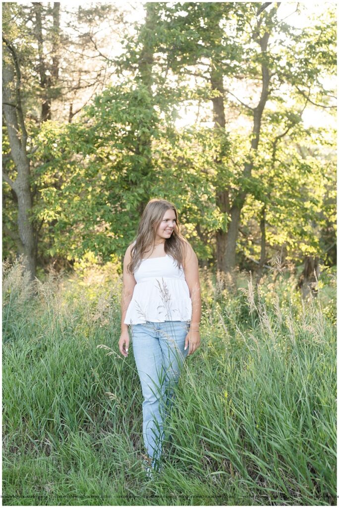 Nebraska senior photos of Waverly High School senior Esther VanOverbeke in tall grass.